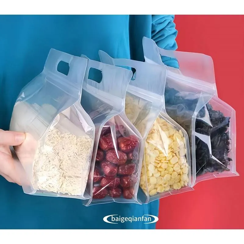 फैक्टरी आउटलेट हैंडल पारदर्शी पैकेजिंग प्लास्टिक बैग फ्लैट बॉटम बैग आठ साइड सील स्नस पाउच